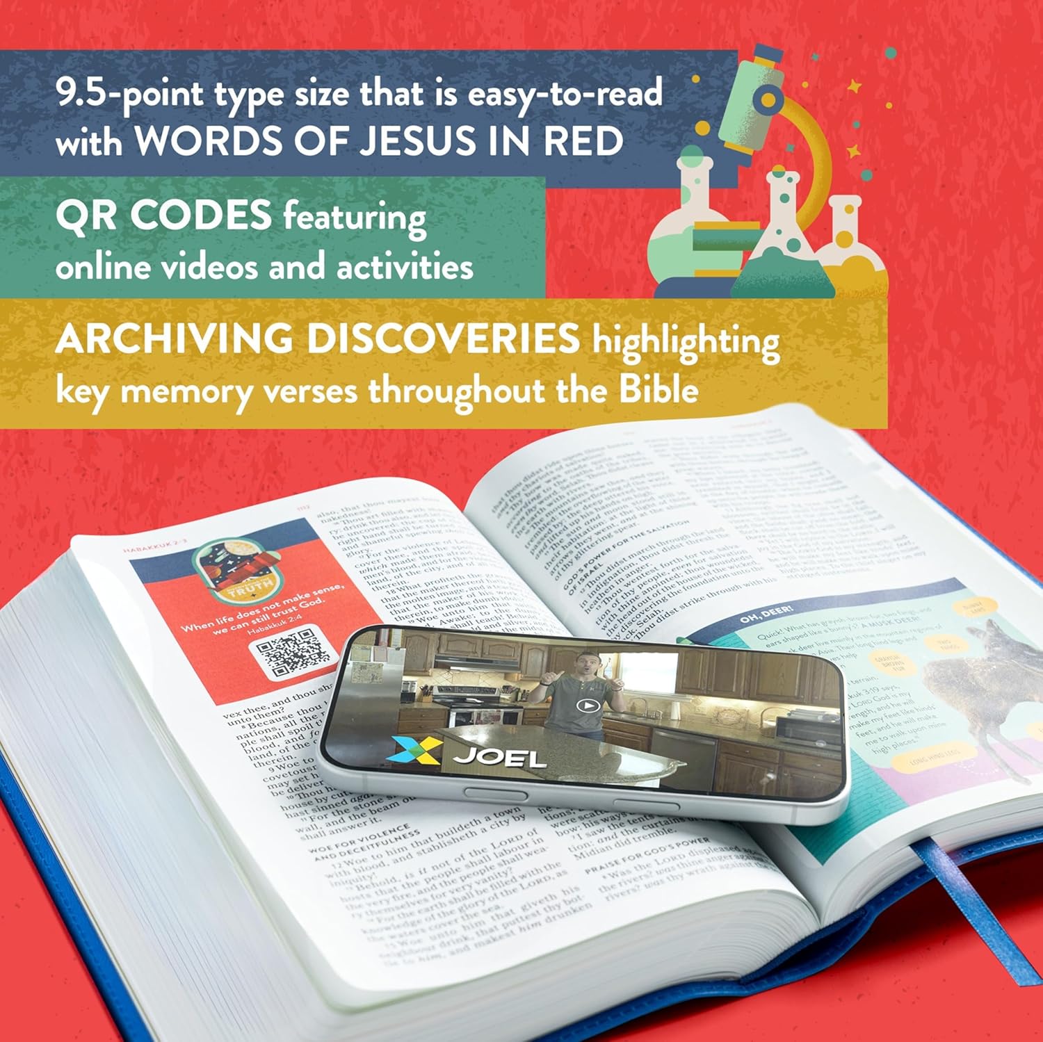 KJV Explorer Bible for Kids – Royal Blue LeatherTouch (Full-Color Study Edition). Open Bible with a smartphone displaying an app interface on a red background