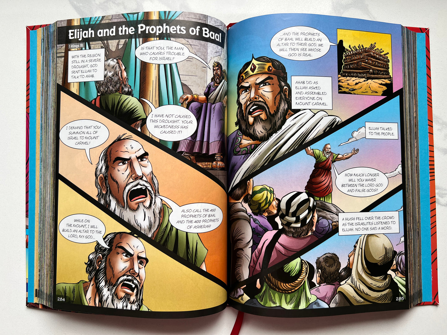 Interior spread of BibleForce: The First Heroes Bible – illustrated comic panels of Elijah and the Prophets of Baal – Christian graphic novel Bible for kids