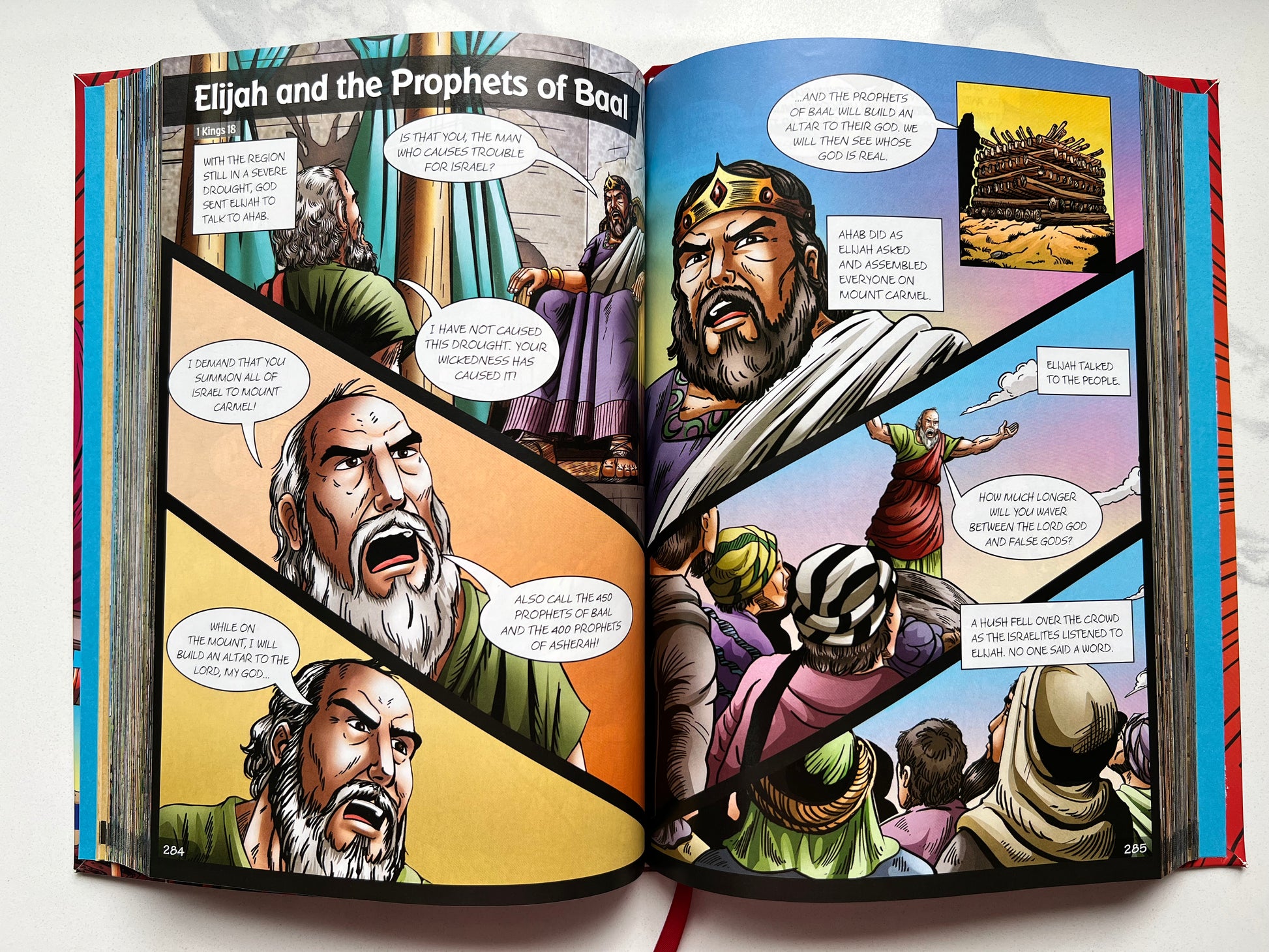 Interior spread of BibleForce: The First Heroes Bible – illustrated comic panels of Elijah and the Prophets of Baal – Christian graphic novel Bible for kids